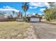 Single-story house with a spacious lawn and attached garage at 904 Orange Blossom Ln, Seffner, FL 33584