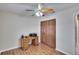 Home office with wood flooring, desk, and built-in shelving at 920 Greenbelt Cir, Brandon, FL 33510