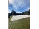 Sand volleyball court with surrounding grassy area and picnic tables at 9730 Asbel Estates St, Land O Lakes, FL 34638