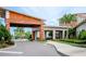 Modern community clubhouse entrance with covered walkway at 10191 Echo Dock Loop, San Antonio, FL 33576