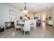 Bright dining area with seating for four and kitchen view at 10191 Echo Dock Loop, San Antonio, FL 33576