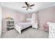 bedroom with twin bed, bookshelf, and ceiling lights at 10458 River Bream Dr, Riverview, FL 33569