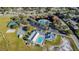 Aerial showcasing community amenities: clubhouse, pool, tennis, playground, parking, and green space at 10805 Keys Gate Dr, Riverview, FL 33579