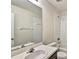 Bathroom with single sink vanity, shower/tub combo, and mirror at 10805 Keys Gate Dr, Riverview, FL 33579