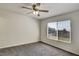 Spacious bedroom with ceiling fan and large window at 10805 Keys Gate Dr, Riverview, FL 33579