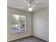 Simple bedroom with ceiling fan, window with blinds and carpet at 10805 Keys Gate Dr, Riverview, FL 33579