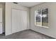 Well-lit bedroom featuring a double-door closet and window at 10805 Keys Gate Dr, Riverview, FL 33579