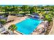 Large community pool with covered seating and lush tropical landscaping perfect for relaxing and enjoying the Florida sunshine at 10805 Keys Gate Dr, Riverview, FL 33579