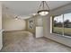 Open dining area with tile floor and light fixture at 10805 Keys Gate Dr, Riverview, FL 33579