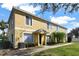 Side view of two-story yellow townhome at 10805 Keys Gate Dr, Riverview, FL 33579