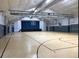 Spacious gymnasium features basketball court and stage at 10805 Keys Gate Dr, Riverview, FL 33579