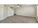 Spacious living room featuring tile floors and a ceiling fan at 10805 Keys Gate Dr, Riverview, FL 33579