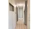 Hallway with tile flooring, neutral paint, and accessible doorways leading to other rooms at 11032 108Th Ave, Largo, FL 33778