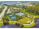 An aerial view of a Primary-planned community, showcasing tennis courts and a recreation center at 11125 Callisia Dr, Odessa, FL 33556