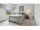 Comfortable bedroom with natural light, neutral walls, and carpet flooring at 11125 Callisia Dr, Odessa, FL 33556