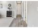 Hallway with hardwood-style flooring, neutral walls, and modern decor at 11125 Callisia Dr, Odessa, FL 33556