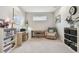 Bright home office with a large window, desk, chair, and modern decor at 11125 Callisia Dr, Odessa, FL 33556