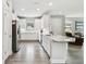 Bright kitchen featuring stainless steel appliances, granite countertops, and white cabinetry at 11125 Callisia Dr, Odessa, FL 33556