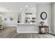 Open concept kitchen featuring stainless steel appliances, a breakfast bar, and modern finishes at 11125 Callisia Dr, Odessa, FL 33556
