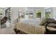 Comfortable bedroom with carpeting, neutral paint and sliding-door access to lanai at 11125 Callisia Dr, Odessa, FL 33556