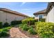 A paver walkway and lush landscaping lead to the side of this beautiful home at 11125 Callisia Dr, Odessa, FL 33556