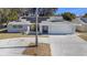 Single-Gathering home with solar panels and driveway at 11828 Bingham Dr, Port Richey, FL 34668