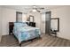 Serene bedroom with ceiling fan and blue bedding at 11828 Bingham Dr, Port Richey, FL 34668