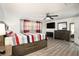 Main bedroom with wood flooring and ceiling fan at 11828 Bingham Dr, Port Richey, FL 34668