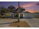 Updated single-story home with a large driveway and landscaped yard at 11828 Bingham Dr, Port Richey, FL 34668