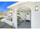 Inviting covered entryway with arched walkway leading to front door at 11828 Bingham Dr, Port Richey, FL 34668