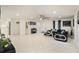 Bright and airy living room featuring a ceiling fan and large windows at 11828 Bingham Dr, Port Richey, FL 34668