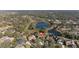 Aerial view of house and neighborhood, featuring a lake nearby at 125 Falling Water Dr, Brandon, FL 33511