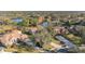 Aerial view showcasing a luxurious home community near a lake at 125 Falling Water Dr, Brandon, FL 33511