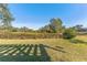 Spacious backyard with lush grass and mature trees at 125 Falling Water Dr, Brandon, FL 33511
