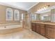 Primary bathroom with soaking tub, shower, and double vanity at 125 Falling Water Dr, Brandon, FL 33511