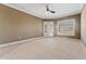 Bright bedroom with large windows and neutral carpeting at 125 Falling Water Dr, Brandon, FL 33511