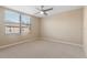 Bright bedroom featuring neutral walls and ceiling fan at 125 Falling Water Dr, Brandon, FL 33511