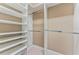 Spacious walk-in closet with ample shelving and hanging space at 125 Falling Water Dr, Brandon, FL 33511