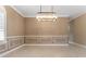 Elegant dining room, featuring a modern chandelier and neutral walls at 125 Falling Water Dr, Brandon, FL 33511