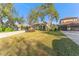 Two-story house with a large yard, driveway and mature trees at 125 Falling Water Dr, Brandon, FL 33511