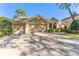 House exterior featuring a two-car garage and manicured lawn at 125 Falling Water Dr, Brandon, FL 33511