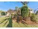 House with manicured lawn and mature landscaping at 125 Falling Water Dr, Brandon, FL 33511