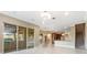 Open concept Gathering room showcasing kitchen and outdoor space at 125 Falling Water Dr, Brandon, FL 33511