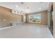 Spacious Gathering room with built-in shelving and large windows at 125 Falling Water Dr, Brandon, FL 33511
