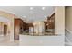 Eat-in kitchen with granite countertops and dark wood cabinets at 125 Falling Water Dr, Brandon, FL 33511