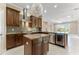 Gourmet kitchen with island, stainless steel appliances, and ample cabinetry at 125 Falling Water Dr, Brandon, FL 33511
