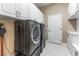 Laundry room with washer, dryer, and additional storage at 125 Falling Water Dr, Brandon, FL 33511