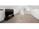 Bonus room featuring grey carpet and a large TV at 1511 Prescott S St, St Petersburg, FL 33712