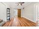 Hardwood floor hallway with barn door and display cabinet at 1511 Prescott S St, St Petersburg, FL 33712