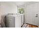 Laundry room with washer, dryer, and a window at 1511 Prescott S St, St Petersburg, FL 33712